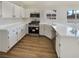 Bright kitchen with sleek countertops, modern appliances, and ample cabinet space at 6412 Dallaswood Ln, Las Vegas, NV 89156
