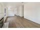 Spacious living room showcasing hardwood flooring and a cozy fireplace at 6412 Dallaswood Ln, Las Vegas, NV 89156