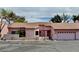 Charming single-story home with a well-maintained front yard and attached two-car garage at 680 Cervantes Dr, Henderson, NV 89014