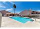 Community pool with a palm tree, offering residents a place to relax at 680 Cervantes Dr, Henderson, NV 89014