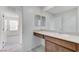 Bathroom with a vanity, sink, mirror and an entry to the bedroom at 7006 Sylmar Ave, Las Vegas, NV 89113