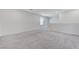 Bright, carpeted bedroom featuring neutral walls and a sunny window at 7006 Sylmar Ave, Las Vegas, NV 89113
