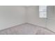 Bedroom with carpeted floors, a window, and a door at 7006 Sylmar Ave, Las Vegas, NV 89113