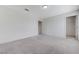 Large empty bedroom with neutral walls and plush carpeting at 7006 Sylmar Ave, Las Vegas, NV 89113