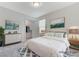Staged bedroom with a queen bed, walk-in closet, and coordinated decor at 7006 Sylmar Ave, Las Vegas, NV 89113