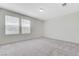 An empty bedroom featuring neutral carpet and windows at 7006 Sylmar Ave, Las Vegas, NV 89113
