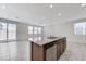 Kitchen featuring an island with a stainless steel dishwasher and sliding glass door access to the outdoors at 7006 Sylmar Ave, Las Vegas, NV 89113