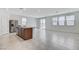 Bright and airy living space with tile floors, stainless steel refrigerator, and modern finishes at 7006 Sylmar Ave, Las Vegas, NV 89113