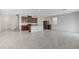 Open-concept living space with tile flooring, ample natural light, and modern kitchen view at 7006 Sylmar Ave, Las Vegas, NV 89113