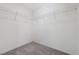 Walk-in closet featuring metal shelving and carpet flooring at 7006 Sylmar Ave, Las Vegas, NV 89113