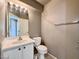 Cozy bathroom with single sink vanity, toilet, and tile flooring at 7173 Dravite Ct, Las Vegas, NV 89148
