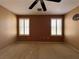 Neutral-toned bedroom with neutral carpet and windows with matching wood blinds at 7173 Dravite Ct, Las Vegas, NV 89148