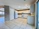 Open kitchen featuring white cabinetry, tile flooring, and modern appliances at 7173 Dravite Ct, Las Vegas, NV 89148