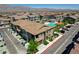 A clear aerial view showcases a townhome near a sparkling community pool and parking area at 7320 N Decatur Blvd # 5, Las Vegas, NV 89131