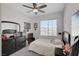 Bedroom featuring a ceiling fan, and window with views at 7320 N Decatur Blvd # 5, Las Vegas, NV 89131