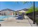 Stunning community pool area with lounge chairs, tables, and umbrellas for residents to enjoy at 7320 N Decatur Blvd # 5, Las Vegas, NV 89131