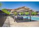 Relaxing community pool area with a covered pergola and seating, perfect for a refreshing swim and lounging at 7320 N Decatur Blvd # 5, Las Vegas, NV 89131
