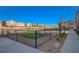 Community dog park featuring secure fencing and manicured lawn, surrounded by residential homes at 7320 N Decatur Blvd # 5, Las Vegas, NV 89131