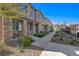 Charming two-story home with stone accents, landscaped yard, and inviting front porch at 7320 N Decatur Blvd # 5, Las Vegas, NV 89131