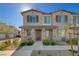 Attractive two-story townhome with stone accents and a cozy front porch at 7320 N Decatur Blvd # 5, Las Vegas, NV 89131