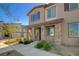 Beautiful two-story townhome with stone accents and a well-maintained front yard at 7320 N Decatur Blvd # 5, Las Vegas, NV 89131
