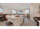 Spacious kitchen with island seating, stainless steel appliances, and an open layout leading to living and dining areas at 7320 N Decatur Blvd # 5, Las Vegas, NV 89131