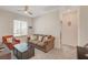 Neutral living room features carpet, ceiling fan, window, and comfortable seating, perfect for relaxation at 7320 N Decatur Blvd # 5, Las Vegas, NV 89131