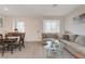 Inviting living room with dining area, neutral colors, plank flooring and modern decor at 7320 N Decatur Blvd # 5, Las Vegas, NV 89131