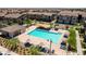 Aerial view of community pool with lounge chairs and shaded seating area at 7320 N Decatur Blvd # 5, Las Vegas, NV 89131