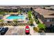 A bird's eye view shows a well-kept community pool, parking and attractive townhomes at 7320 N Decatur Blvd # 5, Las Vegas, NV 89131
