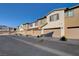 Street view of townhomes with garages, manicured lawns and tidy landscaping at 7320 N Decatur Blvd # 5, Las Vegas, NV 89131