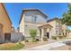 Charming two-story home with well-maintained landscaping and a welcoming entrance at 7323 Sunray Point St, North Las Vegas, NV 89084