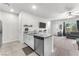 Modern kitchen featuring an island, stainless steel appliances, and open layout at 7323 Sunray Point St, North Las Vegas, NV 89084