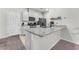 Bright kitchen featuring granite countertops, stainless steel appliances, and ample cabinet space at 7323 Sunray Point St, North Las Vegas, NV 89084