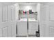 Functional laundry area features side by side washer and dryer within closet space at 7323 Sunray Point St, North Las Vegas, NV 89084