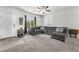 Comfortable living room with a large sectional sofa and plenty of natural light at 7323 Sunray Point St, North Las Vegas, NV 89084