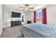 Bright and spacious main bedroom with a mounted TV at 7323 Sunray Point St, North Las Vegas, NV 89084