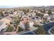 Aerial view of a residential neighborhood with well-maintained homes, and some with swimming pools at 810 Roaring Falls Ave, Henderson, NV 89052