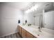 Bright bathroom with double sinks, modern vanity, and a large mirror above at 810 Roaring Falls Ave, Henderson, NV 89052