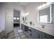 Clean bathroom featuring dual vanity, bright white walls, and modern lighting fixtures for a spa-like feel at 810 Roaring Falls Ave, Henderson, NV 89052