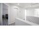 Bright hallway with white walls, neutral flooring, and architectural details at 810 Roaring Falls Ave, Henderson, NV 89052