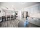 Spacious kitchen with a large island, stainless steel appliances, barstool seating, and a marble backsplash at 810 Roaring Falls Ave, Henderson, NV 89052