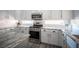 Beautiful kitchen with granite countertops, stainless steel appliances, and white cabinets for a modern aesthetic at 810 Roaring Falls Ave, Henderson, NV 89052