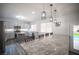 Open kitchen with a large island, stainless steel appliances, eat in kitchen, and access to the backyard at 810 Roaring Falls Ave, Henderson, NV 89052