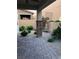 Paver patio with rock landscaping including shrubs and flowers at 8111 Switchback Run St, Las Vegas, NV 89166