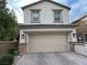Charming two-story home with a two-car garage and well-maintained landscaping at 8111 Switchback Run St, Las Vegas, NV 89166
