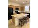 Spacious kitchen with granite countertops and black appliances at 8111 Switchback Run St, Las Vegas, NV 89166