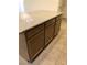 Close up of kitchen island featuring granite countertop and wooden cabinets at 8111 Switchback Run St, Las Vegas, NV 89166