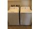 Convenient laundry area with a white washer and dryer set at 8111 Switchback Run St, Las Vegas, NV 89166