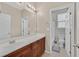 Bright bathroom features a long vanity with double sinks at 8220 Redbud Vine St, North Las Vegas, NV 89085
